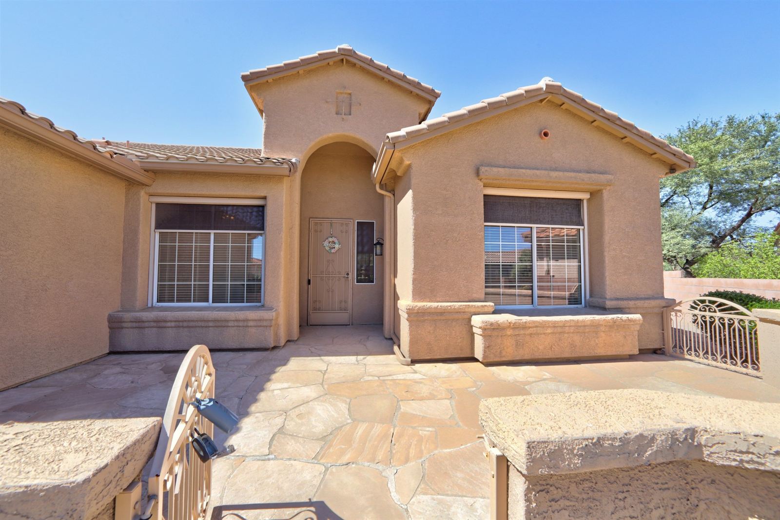 Gated front courtyard and arched entry